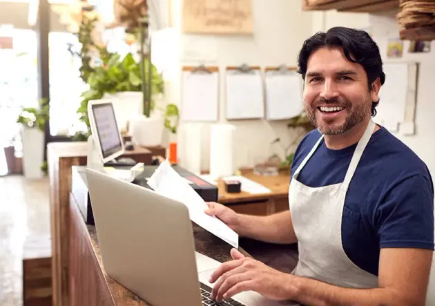A bookkeeping professional organizing financial records for a Nova Scotia business.